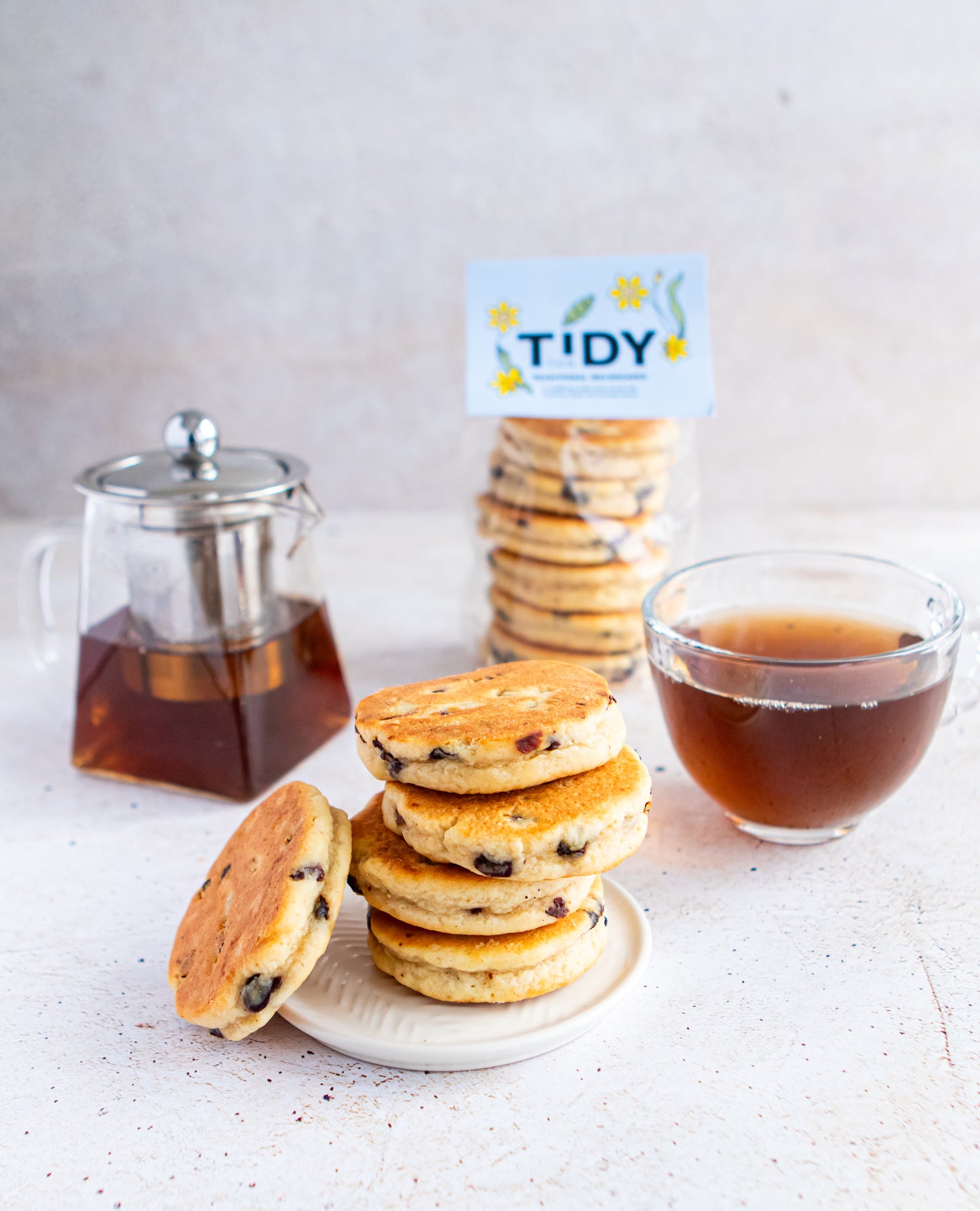 A tower of Welsh cakes with a cup of proper tea