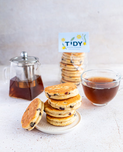 A tower of Welsh cakes with a cup of proper tea